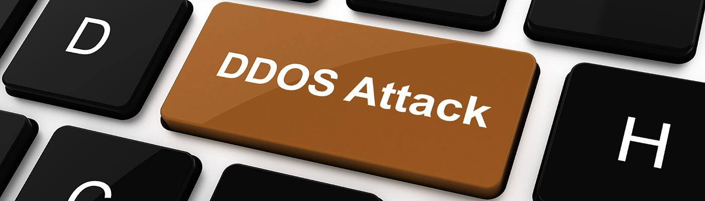 Eine Tastatur mit einer braunen Taste, die "DDOS Attack" zeigt.